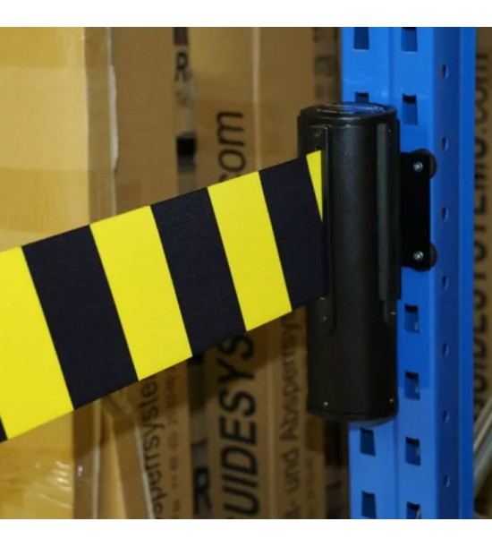 Black and yellow retractable belt unit fixed on blue post close-up of housing and wall mounting